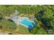 Community pool and recreation area surrounded by lush trees and amenities at 1707 Kashmir White Ln, Fort Mill, SC 29708