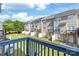 Townhome backyard view from the deck features well maintained lawn with privacy fence at 1707 Kashmir White Ln, Fort Mill, SC 29708