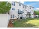 Townhome backyard featuring a well-maintained lawn and a fence at 1707 Kashmir White Ln, Fort Mill, SC 29708