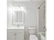 Well-lit bathroom features a shower, toilet and sink with a large mirror above at 1707 Kashmir White Ln, Fort Mill, SC 29708