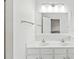 Bright bathroom with double sinks, well-lit vanity, and a large mirror for added convenience at 1707 Kashmir White Ln, Fort Mill, SC 29708