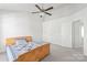 Cozy bedroom featuring a ceiling fan, neutral carpet, and a minimalist wooden bed frame at 1707 Kashmir White Ln, Fort Mill, SC 29708
