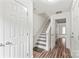Bright entryway with hardwood floors, white trim, and a staircase to the upper level at 1707 Kashmir White Ln, Fort Mill, SC 29708