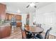 Well-equipped kitchen with wood cabinets, a round dining table, and stainless steel appliances at 1707 Kashmir White Ln, Fort Mill, SC 29708