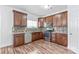 Modern kitchen with wood cabinets, stainless steel appliances, and stylish tile backsplash at 1707 Kashmir White Ln, Fort Mill, SC 29708