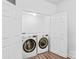 Bright laundry room area features modern washer and dryer units within white double door closet at 1707 Kashmir White Ln, Fort Mill, SC 29708