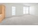 Bright room featuring neutral carpeting, a door to the outside, and a built-in cabinet at 1707 Kashmir White Ln, Fort Mill, SC 29708