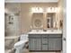 Bathroom showcases a double vanity, neutral tiling, and a glass-enclosed shower for a sleek, modern look at 17913 Ragtop Day Ln, Cornelius, NC 28031
