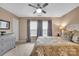 Cozy bedroom featuring a ceiling fan, soft carpet, natural light, and neutral paint at 17913 Ragtop Day Ln, Cornelius, NC 28031