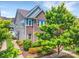 Beautiful two-story home with brick and vinyl siding, lush landscaping, and a well-maintained lawn at 17913 Ragtop Day Ln, Cornelius, NC 28031