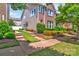 Charming two-story home featuring brick and vinyl siding with a lush lawn and driveway at 17913 Ragtop Day Ln, Cornelius, NC 28031