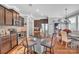 Modern kitchen with stainless steel appliances, granite countertops, and a breakfast bar at 17913 Ragtop Day Ln, Cornelius, NC 28031