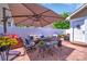 Outdoor patio seating with umbrella and fenced perimeter at 17913 Ragtop Day Ln, Cornelius, NC 28031