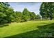 Lush green yard with mature trees and plenty of space at 1905 Mereview Ct # 21, Charlotte, NC 28210