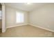 Bedroom featuring a large window and tiled flooring at 1905 Mereview Ct # 21, Charlotte, NC 28210