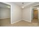 Bright dining area with tile flooring and a modern light fixture at 1905 Mereview Ct # 21, Charlotte, NC 28210