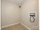 Compact laundry room with utility hookups and a clean, neutral color palette, providing a functional space at 1905 Mereview Ct # 21, Charlotte, NC 28210