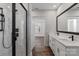 Modern bathroom boasting double sinks, marble countertop, large mirror, and a glass enclosed shower at 1933 Hendricks St, Rock Hill, SC 29732