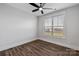 This cozy bedroom features wood-look floors, neutral walls, and a ceiling fan for comfortable living at 1933 Hendricks St, Rock Hill, SC 29732