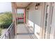 Outdoor balcony featuring a metal fence, exterior lights, and an overhead roofline at 2092 Ayrsley Town Blvd, Charlotte, NC 28273