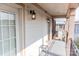 Outdoor balcony featuring a metal fence, exterior lights, and an overhead roofline at 2092 Ayrsley Town Blvd, Charlotte, NC 28273