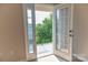 Balcony view with metal railings overlooking green trees and exterior residential neighborhood at 2092 Ayrsley Town Blvd, Charlotte, NC 28273