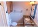 Bathroom with granite countertop, wooden cabinets, and bronze fixtures at 2092 Ayrsley Town Blvd, Charlotte, NC 28273