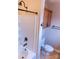 This bathroom features a shower-tub combination with a white tile surround and bronze fixtures at 2092 Ayrsley Town Blvd, Charlotte, NC 28273
