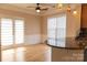 Bright dining area with hardwood floors, pendant lighting, and access to outdoor space through glass doors at 2092 Ayrsley Town Blvd, Charlotte, NC 28273