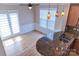 Sun-drenched kitchen area with hardwood floors, island with granite countertop, and modern pendant lighting at 2092 Ayrsley Town Blvd, Charlotte, NC 28273