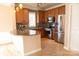 Modern kitchen features wooden cabinets, stainless steel appliances, and a tiled backsplash at 2092 Ayrsley Town Blvd, Charlotte, NC 28273