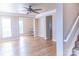 Open-concept living room with hardwood floors, and built-in desk at 2092 Ayrsley Town Blvd, Charlotte, NC 28273