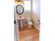 Stylish powder room with hardwood floors, modern fixtures, and natural light at 2092 Ayrsley Town Blvd, Charlotte, NC 28273