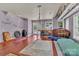 The recreation room features hardwood floors, natural light and space for activities and relaxation at 2092 Ayrsley Town Blvd, Charlotte, NC 28273
