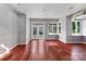 Bright, open room with hardwood floors, large windows, and an exterior entrance at 2092 Ayrsley Town Blvd, Charlotte, NC 28273