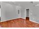 Minimalist room with hardwood floors, a neutral wall, and a doorway at 2092 Ayrsley Town Blvd, Charlotte, NC 28273