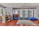 Bright room featuring hardwood floors, natural light, and various recreational equipment at 2092 Ayrsley Town Blvd, Charlotte, NC 28273