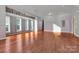 Open room with hardwood floors, natural light, and flexible space at 2092 Ayrsley Town Blvd, Charlotte, NC 28273