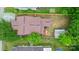 Aerial view of a property with a fenced backyard, mature trees, and well-maintained landscaping showcasing property boundaries at 2212 Acme Rd, Belmont, NC 28012