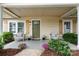 Inviting front porch with comfortable seating, decorative plants, and a welcoming entrance at 2212 Acme Rd, Belmont, NC 28012