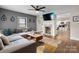 Open-concept living room with a modern fireplace, comfortable seating, and seamless flow to the kitchen at 2212 Acme Rd, Belmont, NC 28012