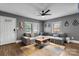 Stylish living room with a comfortable sectional sofa, modern decor, and ample natural light at 2212 Acme Rd, Belmont, NC 28012