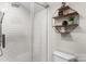 Modern shower with glass enclosure, white subway tile, and corner shelving adding style and functionality at 2212 Acme Rd, Belmont, NC 28012