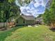 A well-maintained backyard with green lawn, patio, and a storage shed, creating a relaxing outdoor space at 2323 Arden St, Charlotte, NC 28206