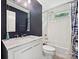 Chic bathroom featuring a vanity with marble countertop, soaking tub, and modern fixtures, combining style and functionality at 2323 Arden St, Charlotte, NC 28206