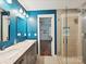 Elegant bathroom with a dual sink vanity, marble countertops, and a glass-enclosed shower, providing a spa-like experience at 2323 Arden St, Charlotte, NC 28206