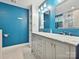 Modern bathroom featuring dual sinks, stylish vanity, marble countertops, and contemporary fixtures at 2323 Arden St, Charlotte, NC 28206