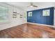 Serene bedroom with blue accent wall, natural light, and hardwood floors, creating a peaceful retreat at 2323 Arden St, Charlotte, NC 28206