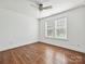 Minimalist bedroom with hardwood floors and bright windows, creating a calm and inviting atmosphere at 2323 Arden St, Charlotte, NC 28206