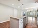 Modern kitchen island with storage, stainless appliances, and sightlines to the living area at 2323 Arden St, Charlotte, NC 28206